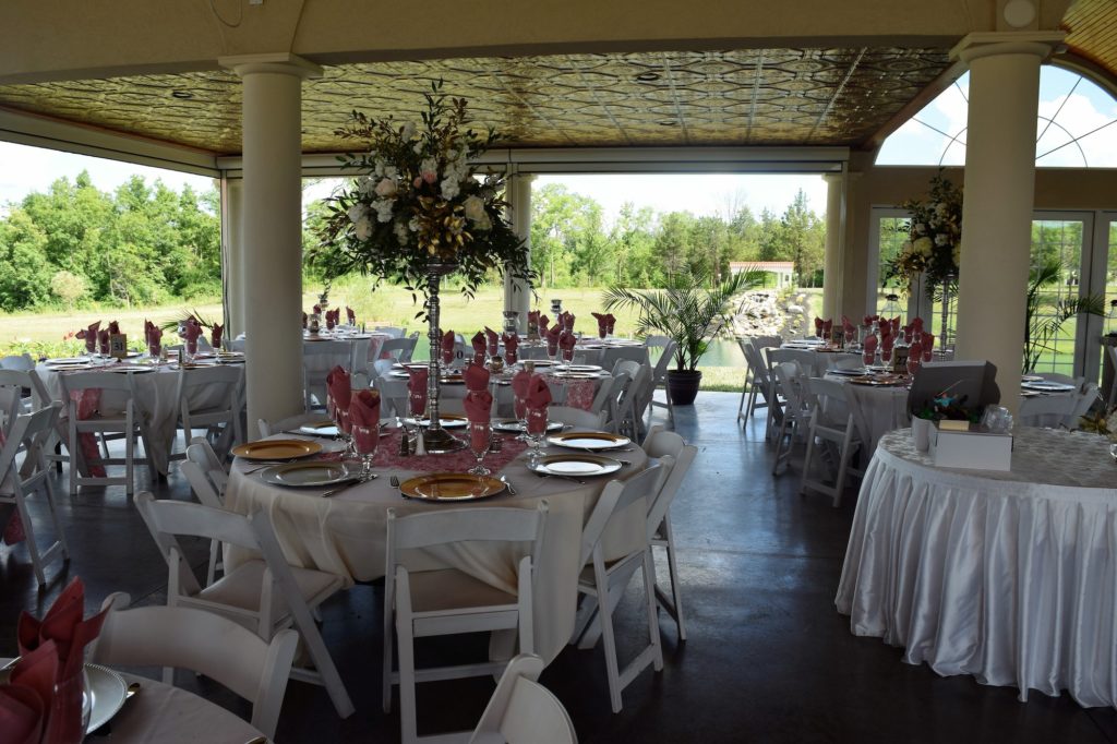elegant outdoor wedding tables and chairs under open air pavilion