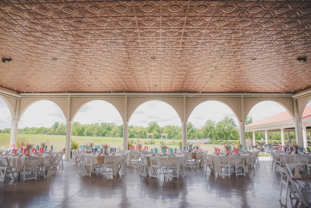 classy outdoor wedding venue with copper ceiling tiles