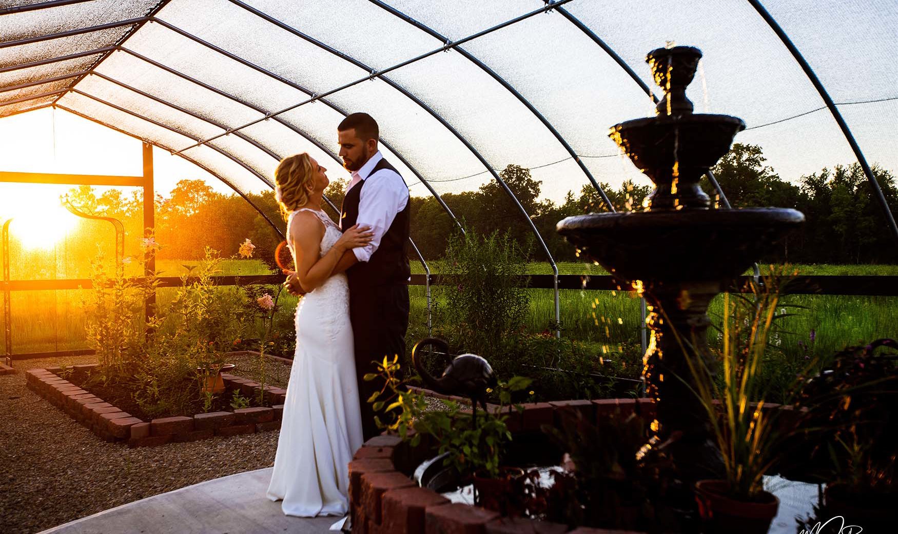 bride and groom in front of ohio sunset at outdoor wedding