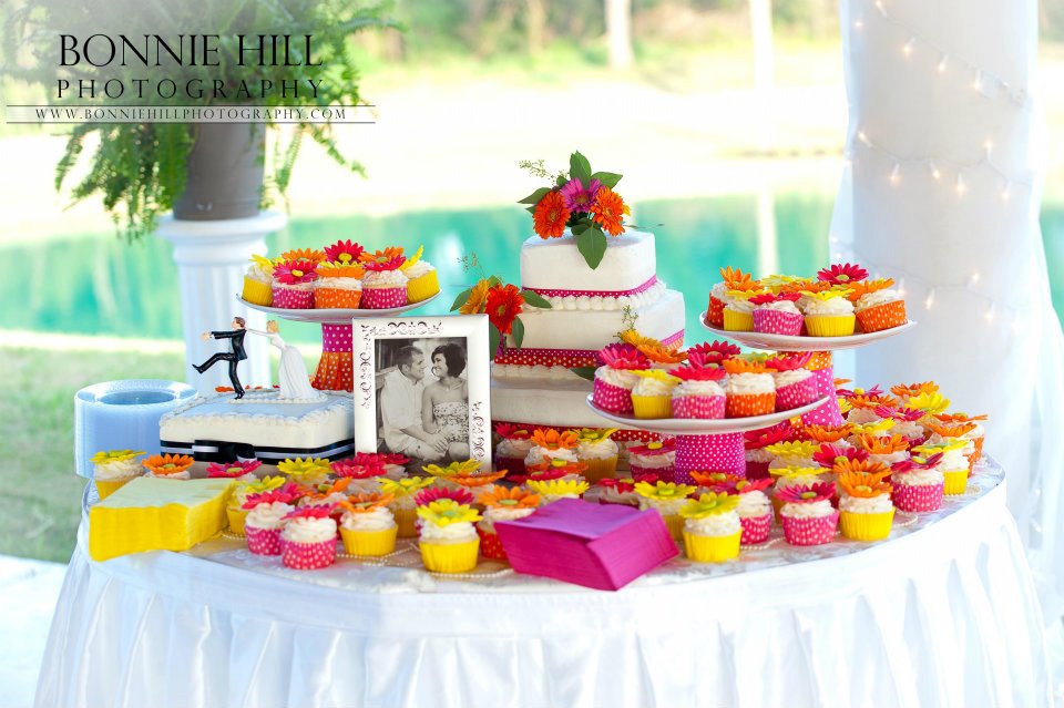wedding cupcakes in front of tropical looking pond